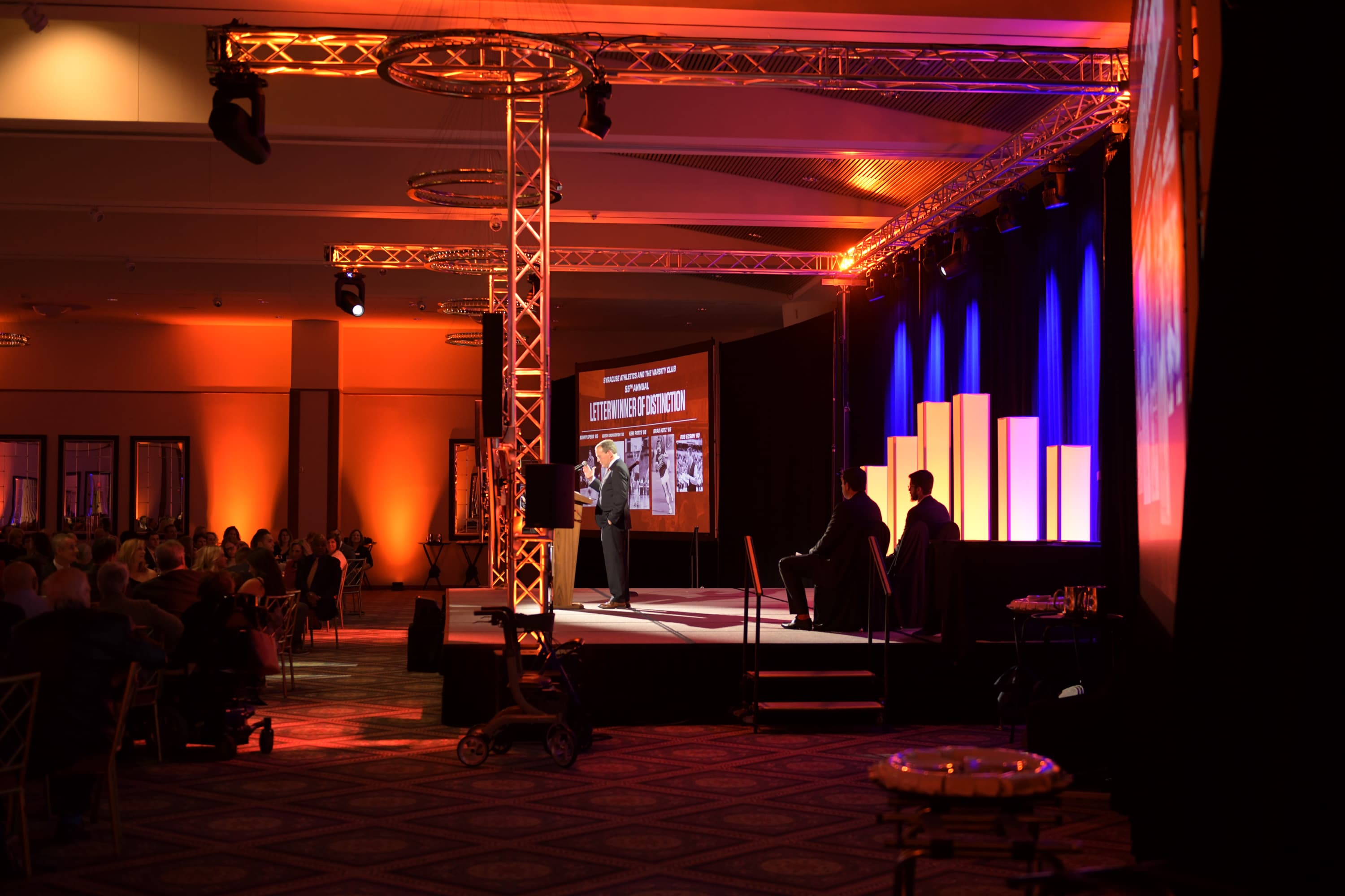Syracuse stage lighting setup with uplighting and truss